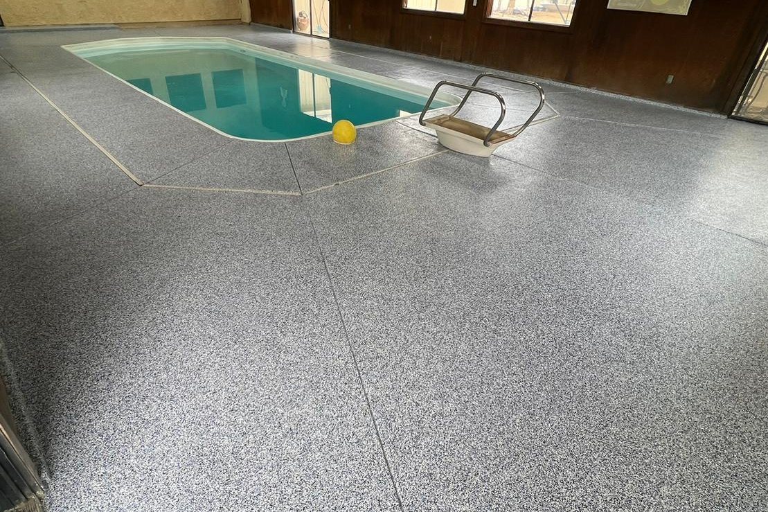 Blue-gray flake coating around an indoor pool in Los Angeles
