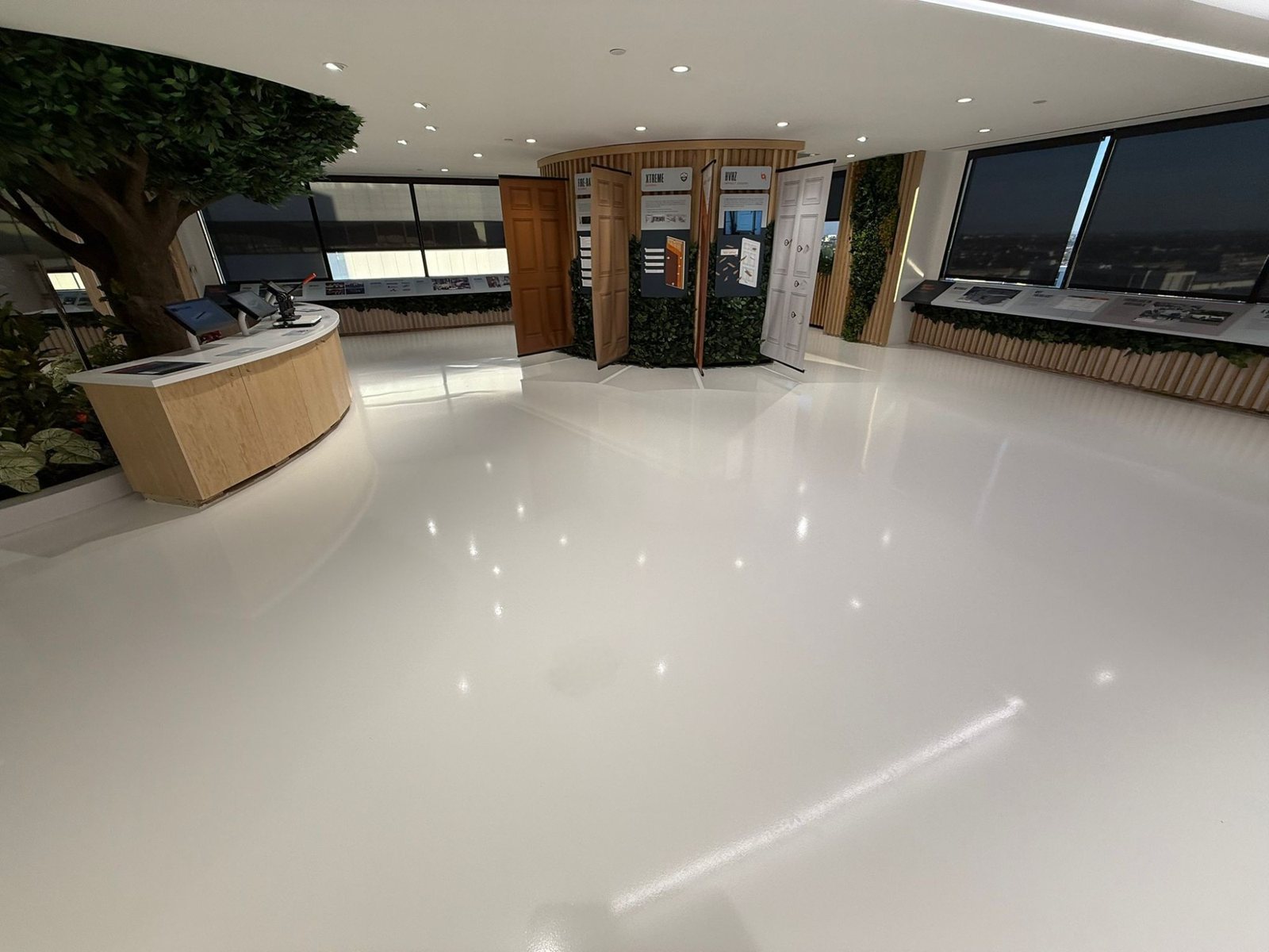 Self-leveling white epoxy floor across a Los Angeles office space