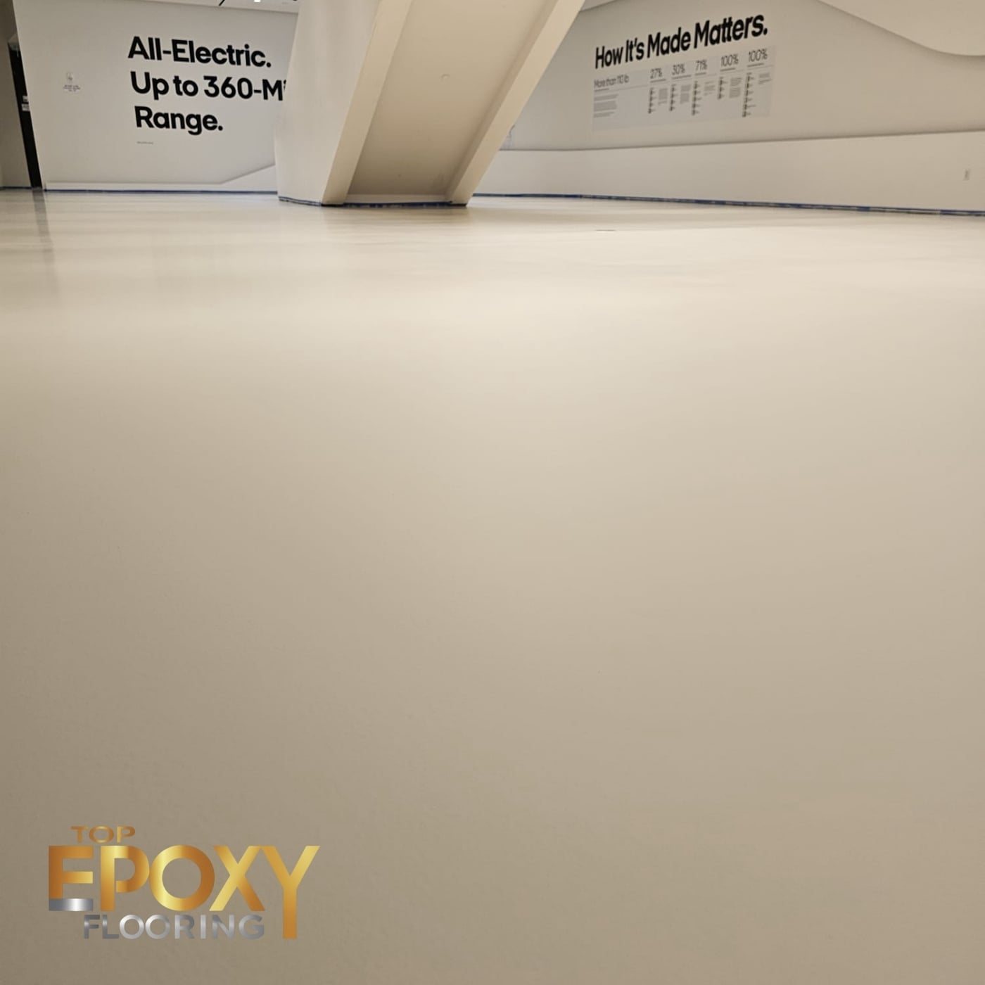 White solid color epoxy floor across a Los Angeles showroom